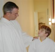Pastor baptizing a boy in church